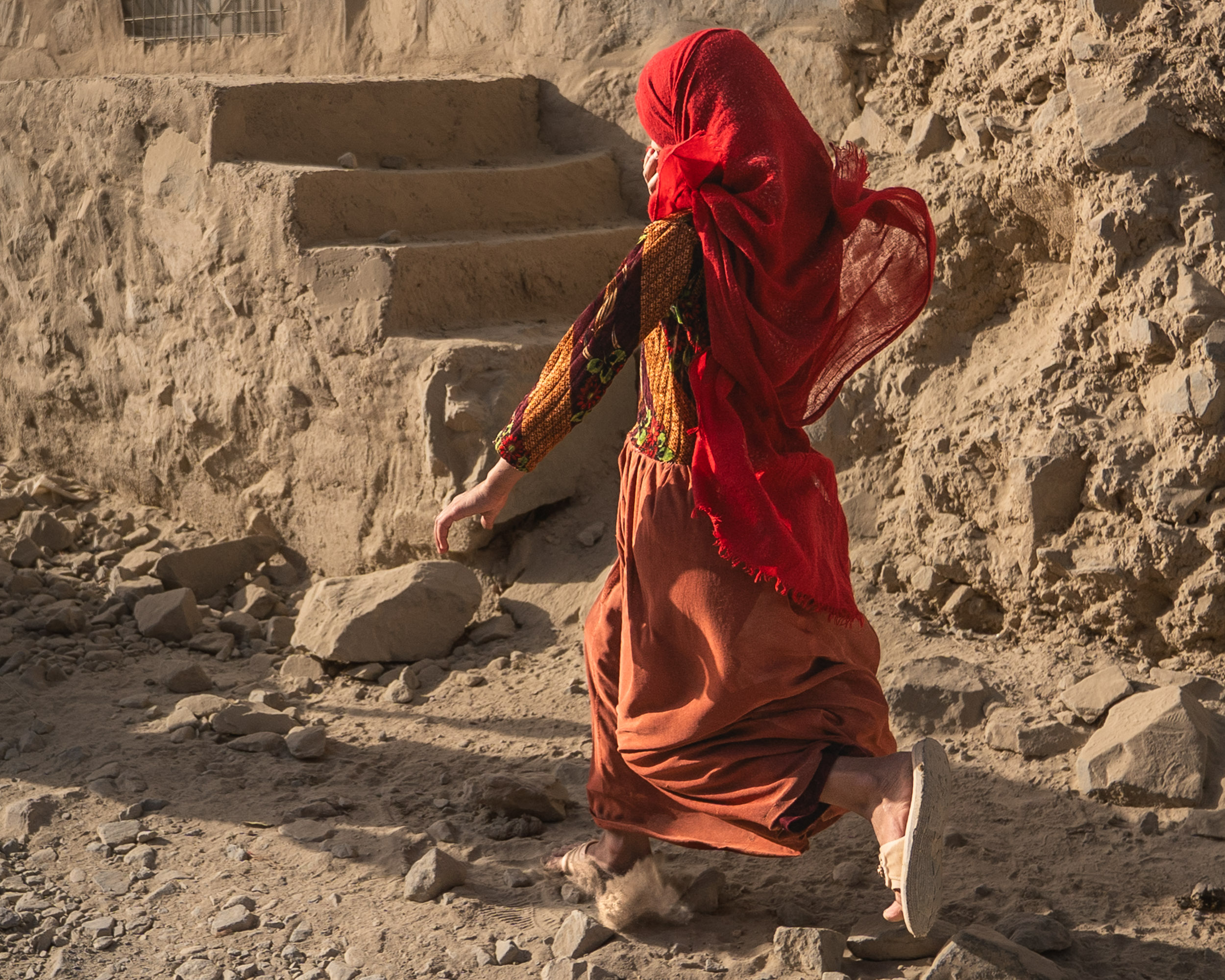 Running woman in dust